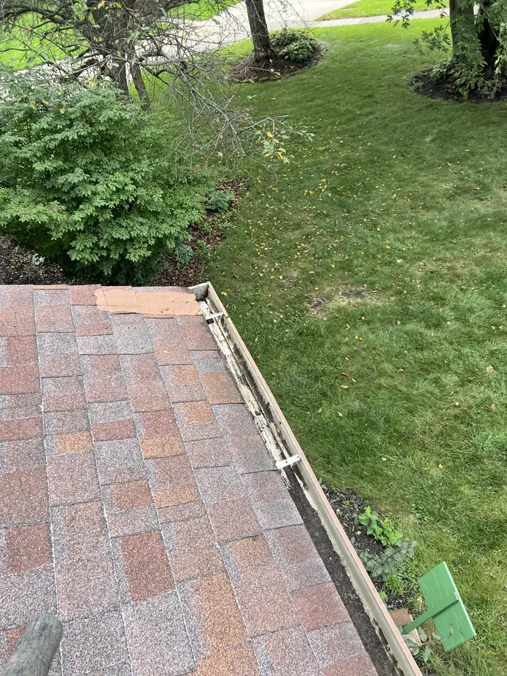 Front roofline gutter on a two-story Libertyville house after professional gutter cleaning